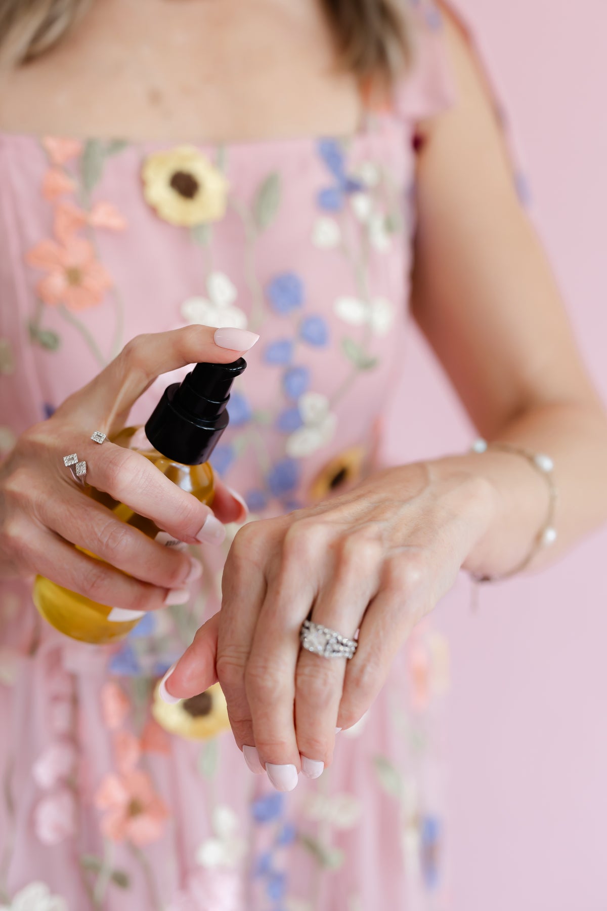 mac + mitchell founder kelly goodwin holding oil crush cleansing oil bottle