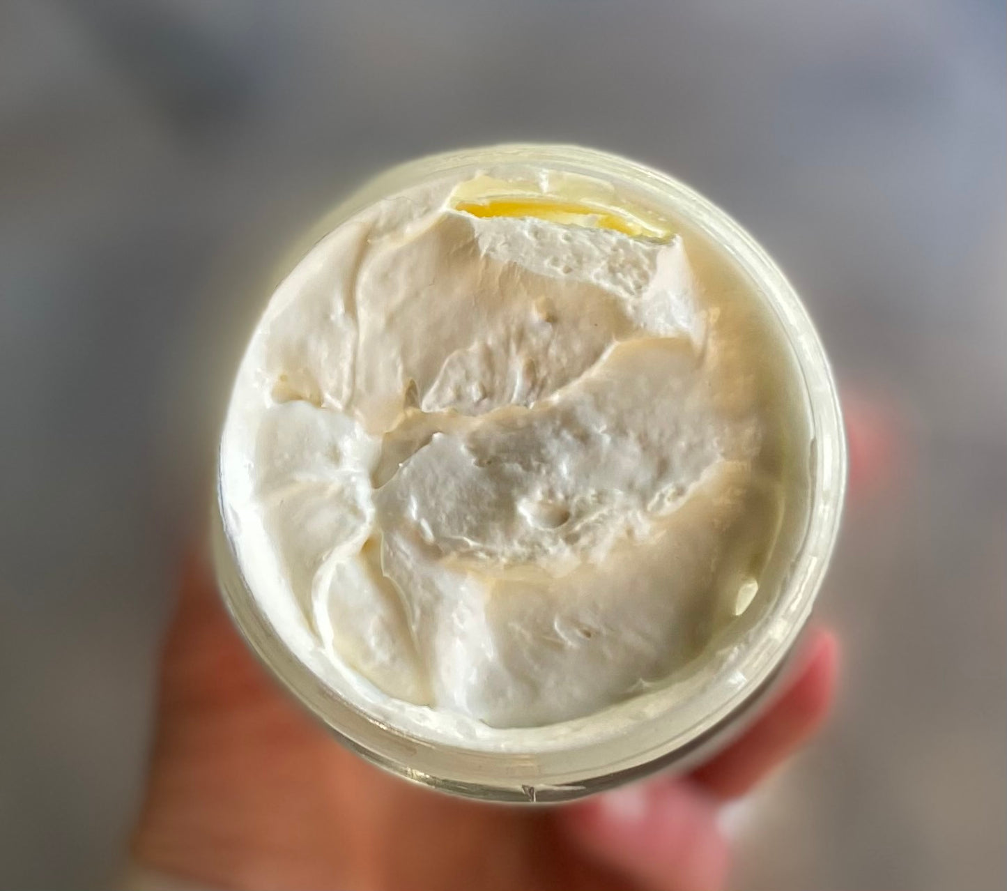 close up of mac + mitchell petal + pasture botanical earth whipped tallow showing creamy texture
