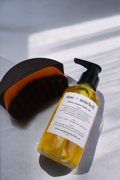 mac + mitchell body oil bottle with pump top and body brush