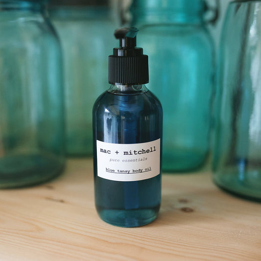 mac + mitchell blue tansy body oil in dark glass bottle with front label