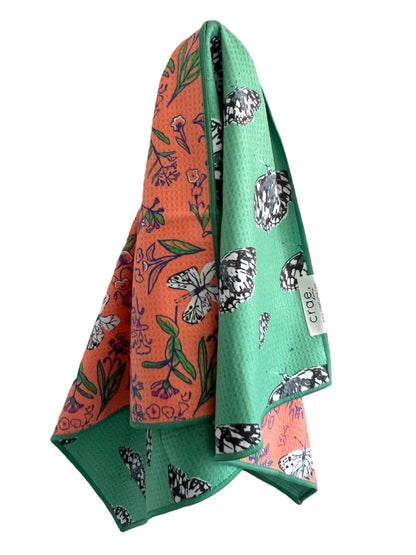 microfiber hand towel draped showing green butterfly pattern by mac + mitchell