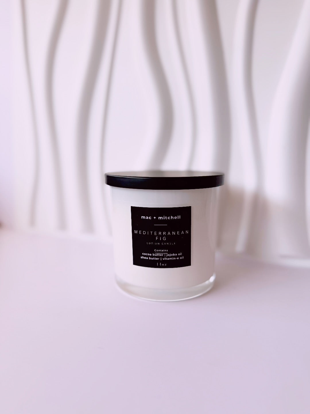 mac + mitchell luxurious lotion candle label detail on white glass container