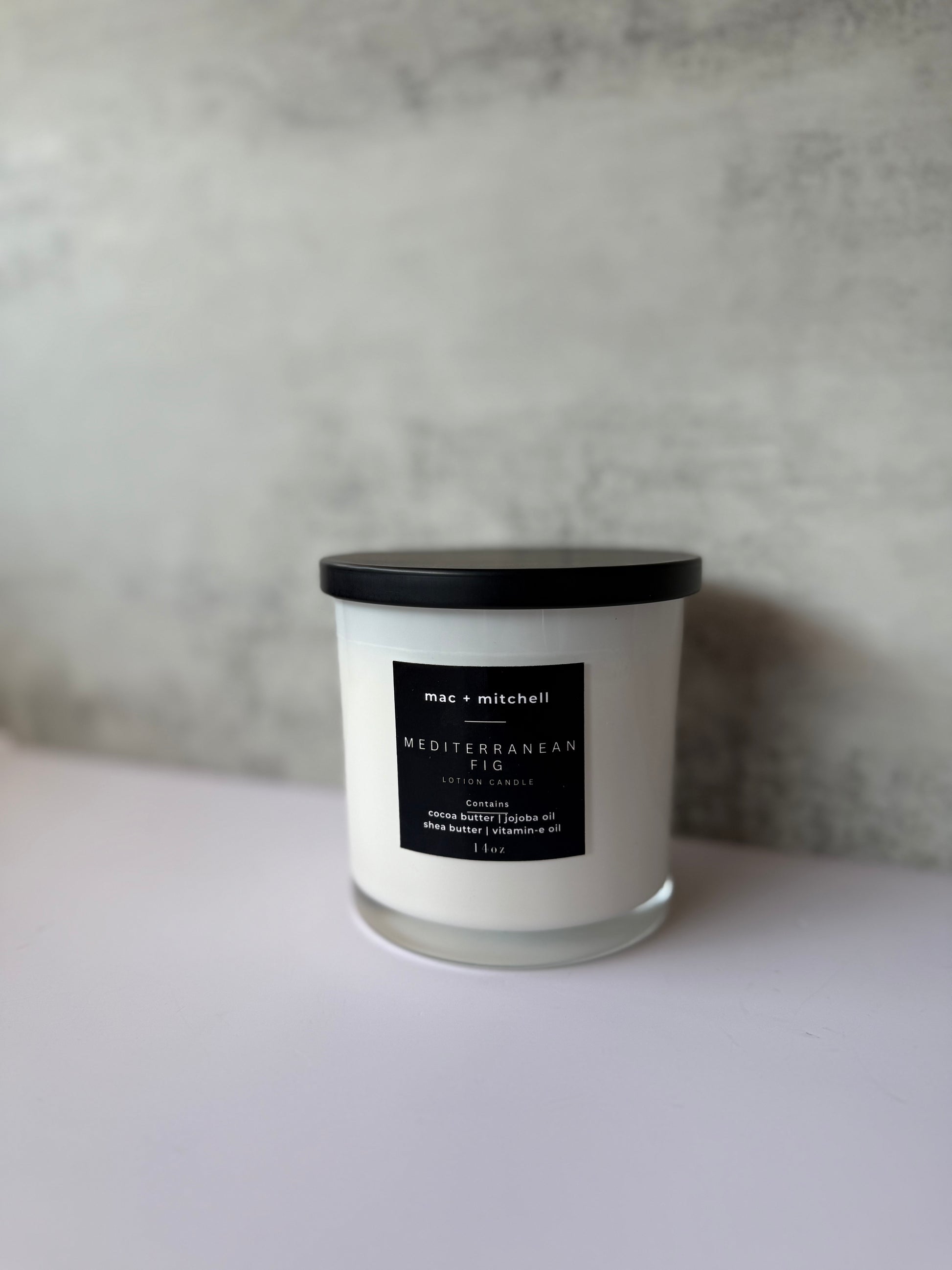 mac + mitchell luxurious lotion candle in white glass container with wooden wick