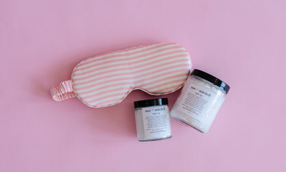 mac + mitchell nightcap magnesium cream glass jar with striped sleep mask on pink background