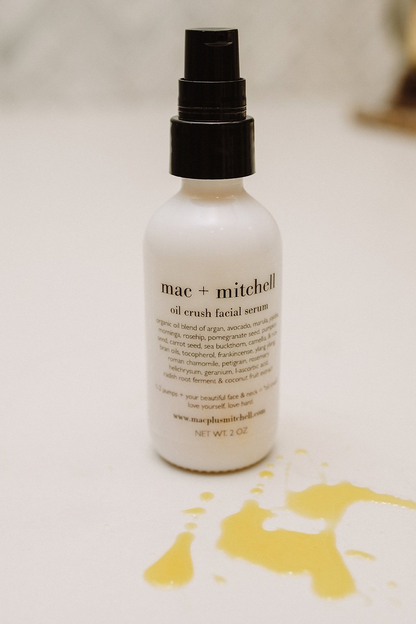 mac + mitchell oil crush facial serum bottle with botanical greenery