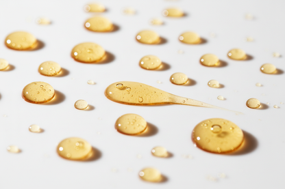 mac + mitchell oil crush facial serum golden botanical oil droplets close up