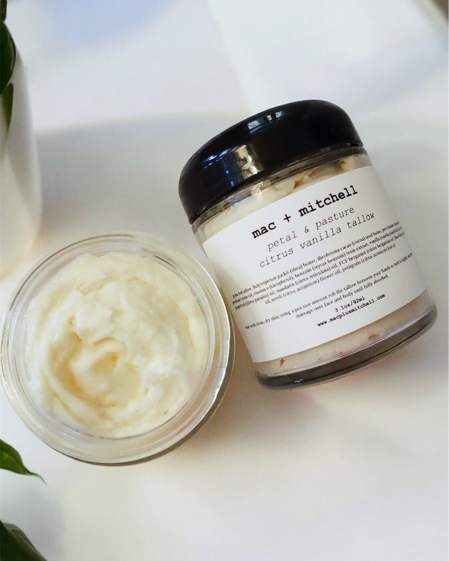 mac + mitchell petal + pasture grass fed whipped tallow in glass jar with black lid