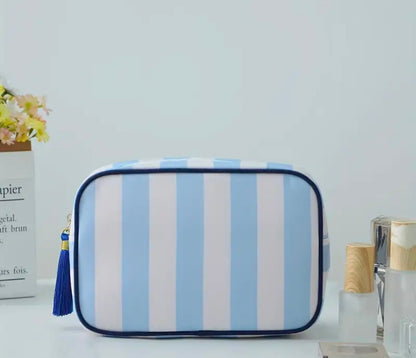 mac + mitchell striped cosmetic bags in multiple color options on pink background